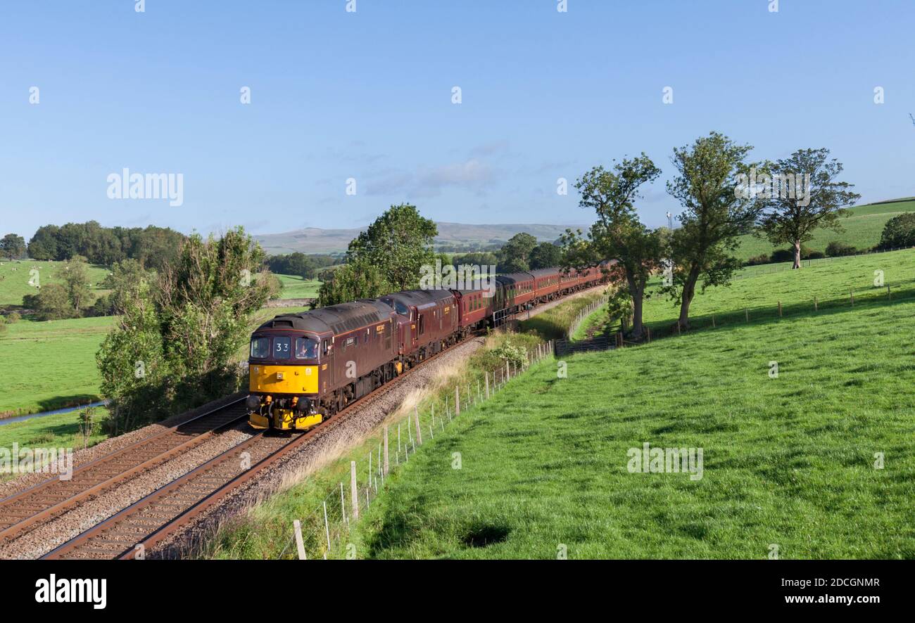 The Scarborough Spa Express charter train passing through the Aire valley with a West Coast railways class 33 locomotive leading Stock Photo