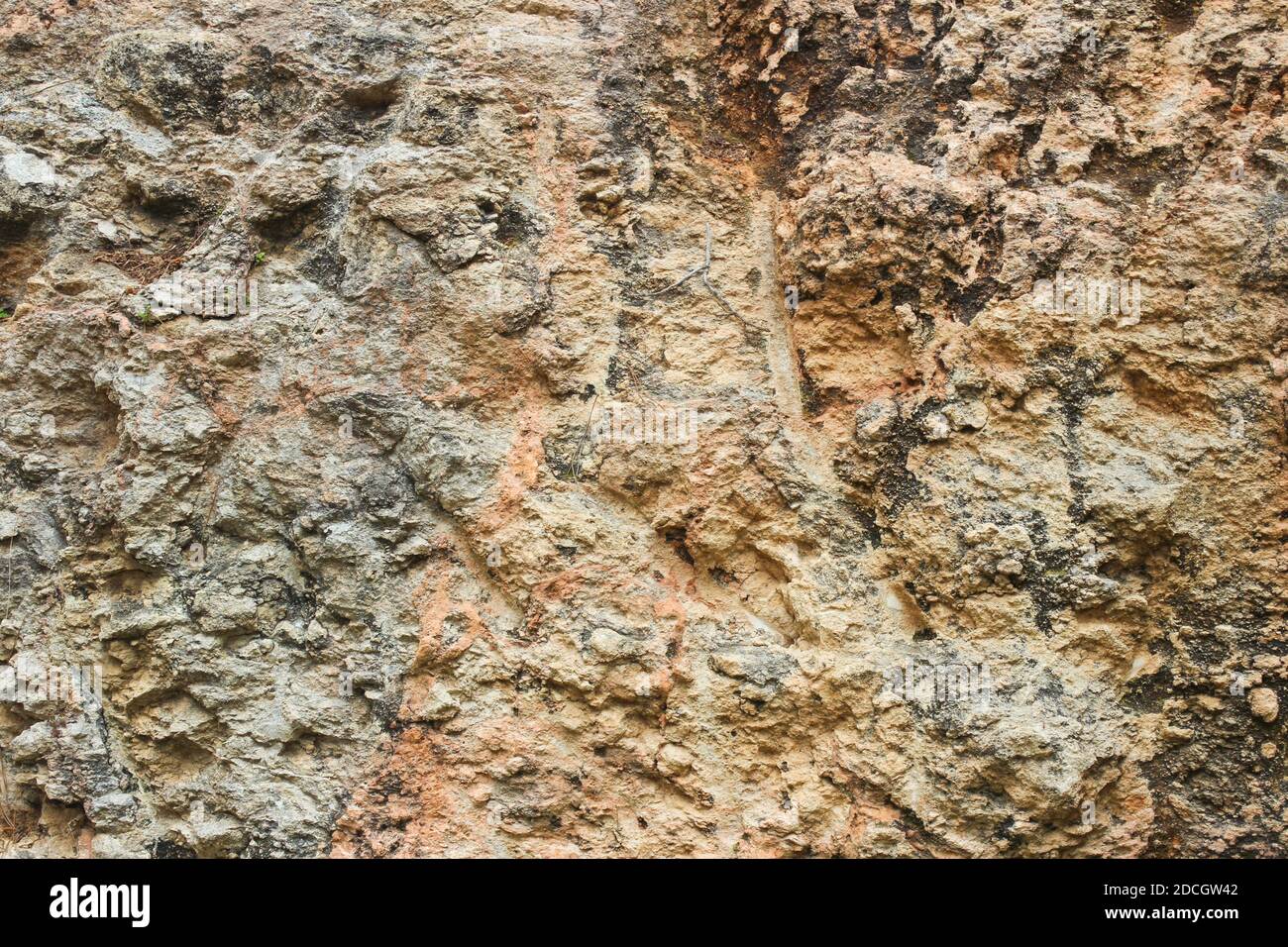 Textured sheer stone wall as background Stock Photo