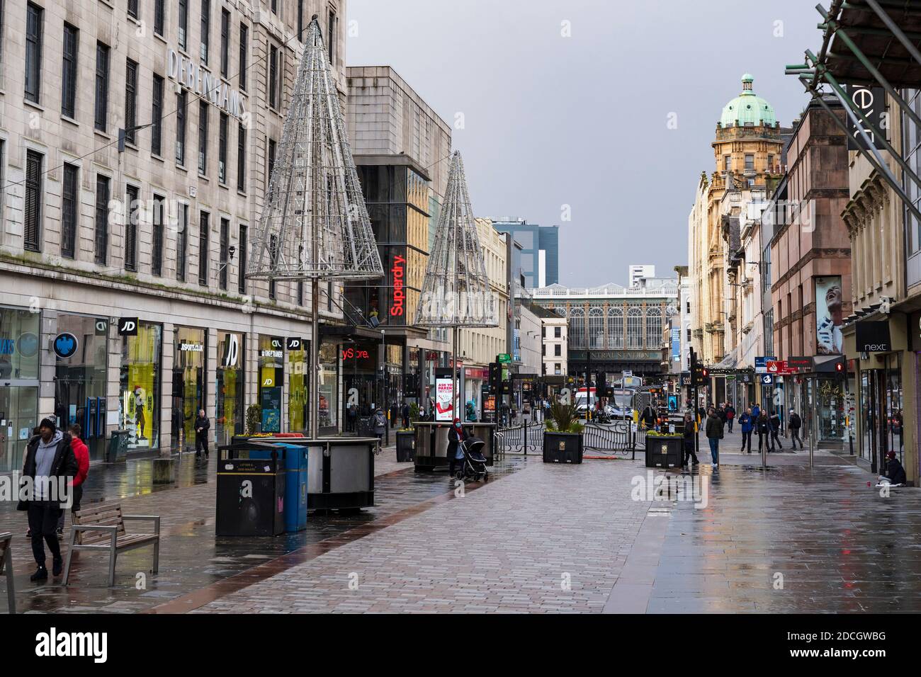 Glasgow, Scotland, UK. 21 November 2020. Views of Saturday afternoon in Glasgow city centre on first day of level 4 lockdown. Non essential shops and businesses have closed. And streets are very quiet. Pictured; Argyle Street is almost deserted   .Iain Masterton/Alamy Live News Stock Photo