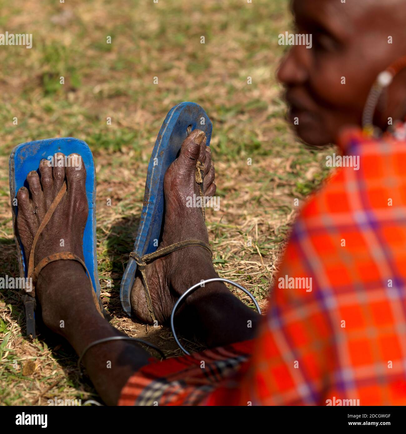 Maasai tribe woman wearing flip flops, Rift Valley Province, Maasai Mara, Kenya Stock Photo