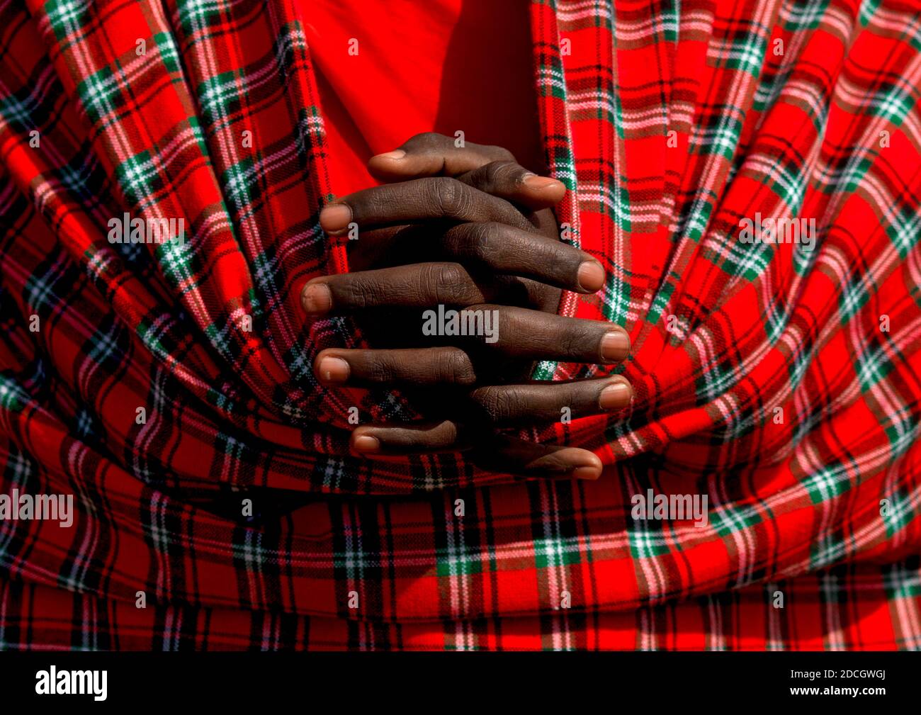 Maasai tribe man hands crossed, Rift Valley Province, Maasai Mara, Kenya Stock Photo