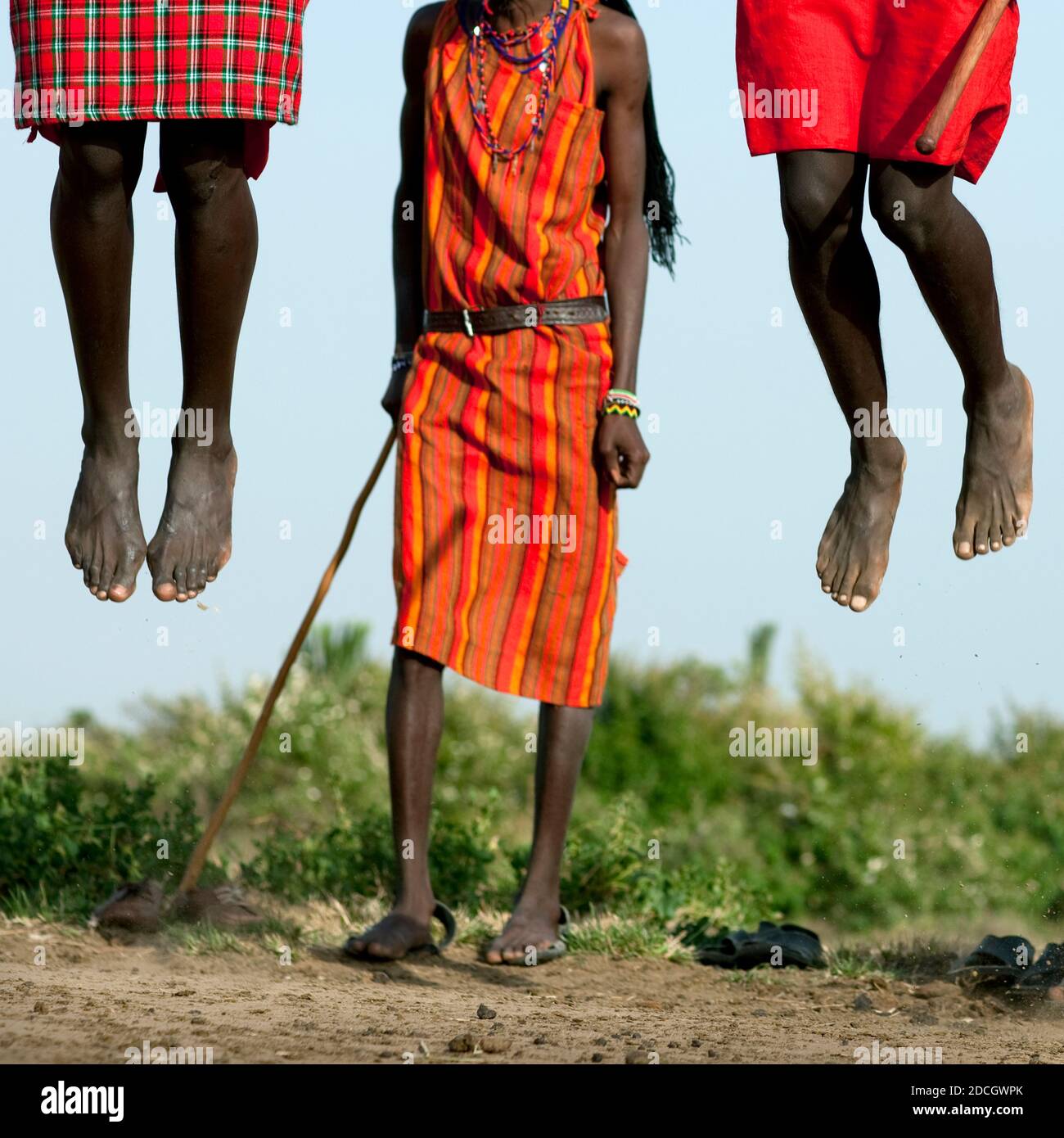 Maasai tribe men jumping during a ceremony, Rift Valley Province, Maasai Mara, Kenya Stock Photo