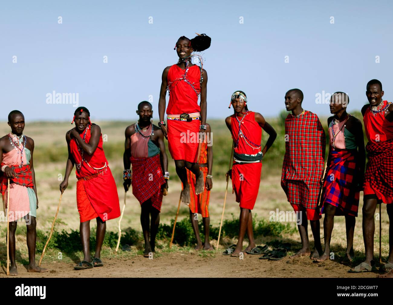 Maasai tribe men jumping during a ceremony, Rift Valley Province, Maasai Mara, Kenya Stock Photo