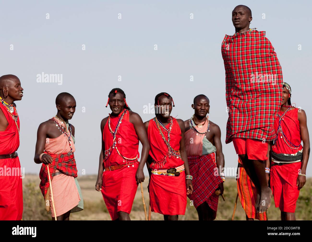 Maasai tribe men jumping during a ceremony, Rift Valley Province, Maasai Mara, Kenya Stock Photo