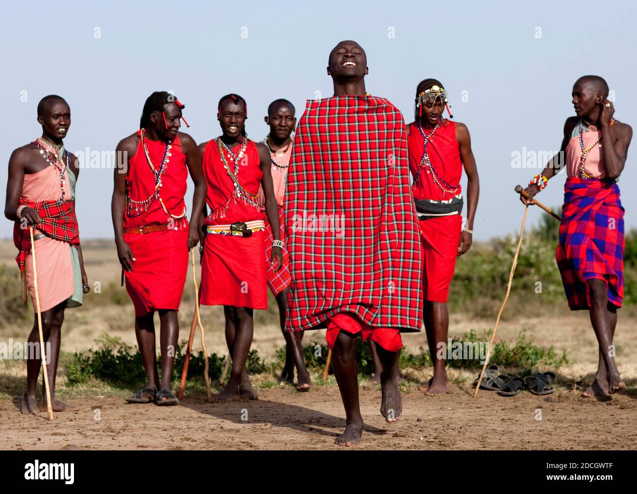 Maasai tribe men jumping during a ceremony, Rift Valley Province, Maasai Mara, Kenya Stock Photo