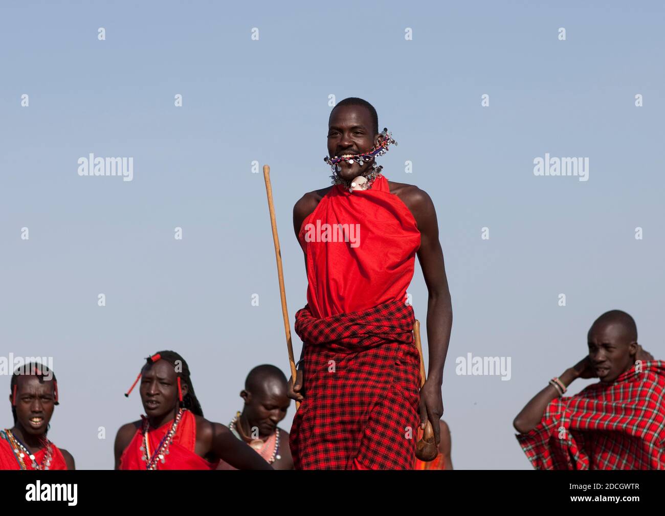 Maasai tribe men jumping during a ceremony, Rift Valley Province, Maasai Mara, Kenya Stock Photo