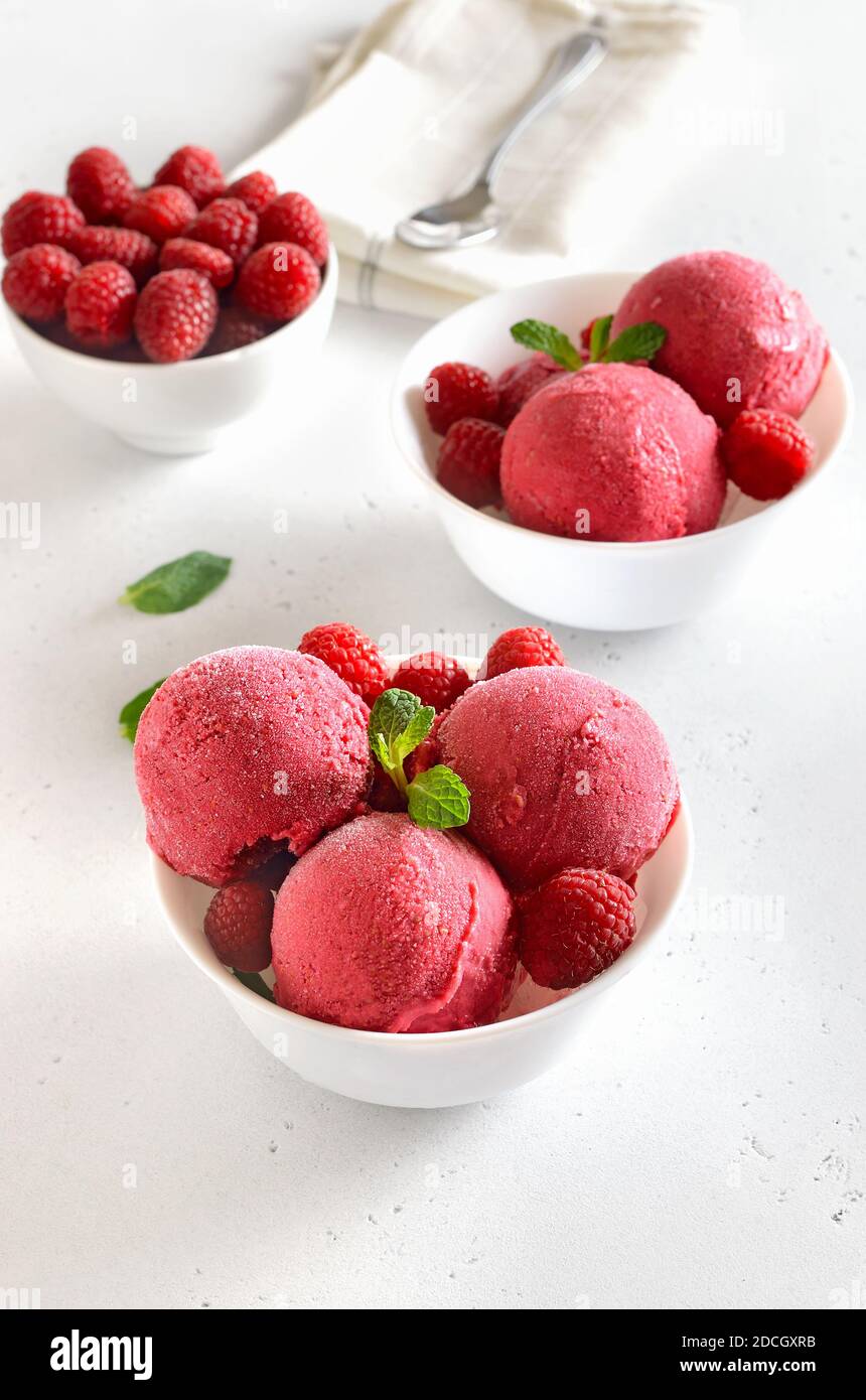 https://c8.alamy.com/comp/2DCGXRB/homemade-raspberry-ice-cream-scoop-with-fresh-raspberries-in-white-bowl-cold-summer-dessert-2DCGXRB.jpg