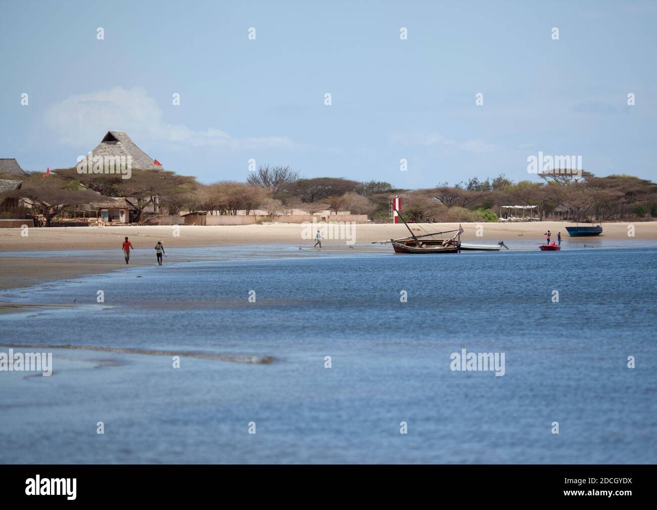 People walking on the beach in front Majlis hotel, Lamu County, Manda ...