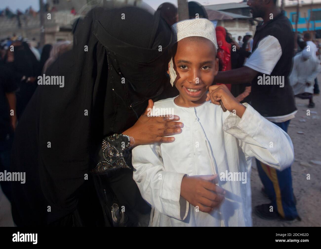 Muslim boy with bank notes under his kofia during Maulid festival, Lamu County, Lamu, Kenya Stock Photo
