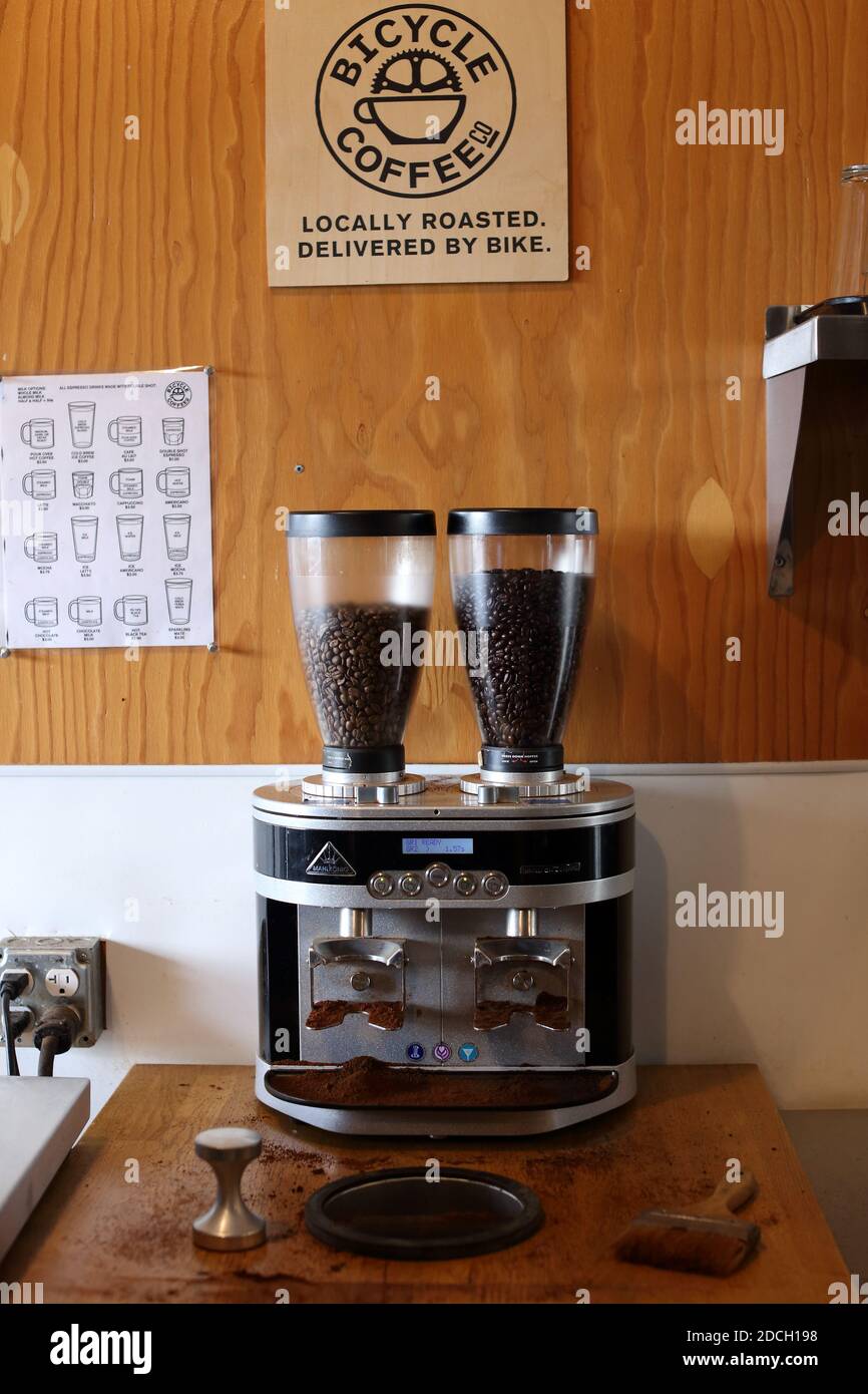 UNITED STATES / California / Oakland  /Coffee Style / Mahlkoenig twin coffee grinder at the Bicycle Coffee Company .freshly ground portion grinding. Stock Photo