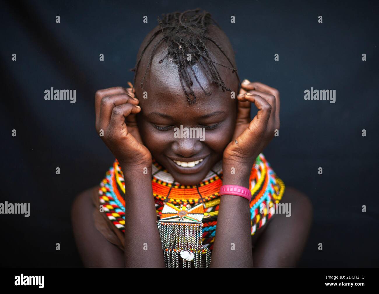 Smiling Turkana tribe woman with necklaces and earrings, Rift Valley Province, Turkana lake, Kenya Stock Photo