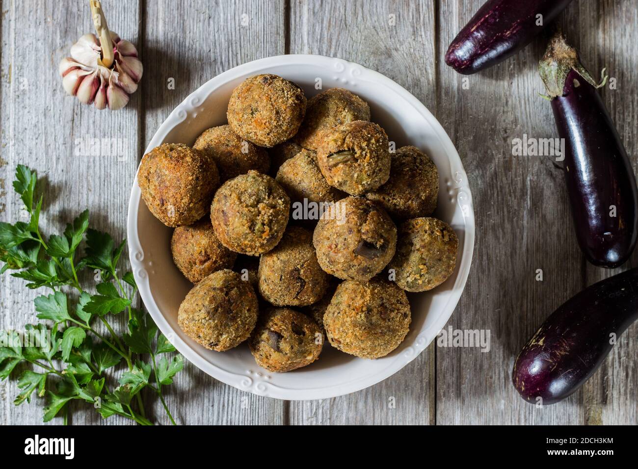 Meatless eggplant meatballs on wooden background Stock Photo Alamy