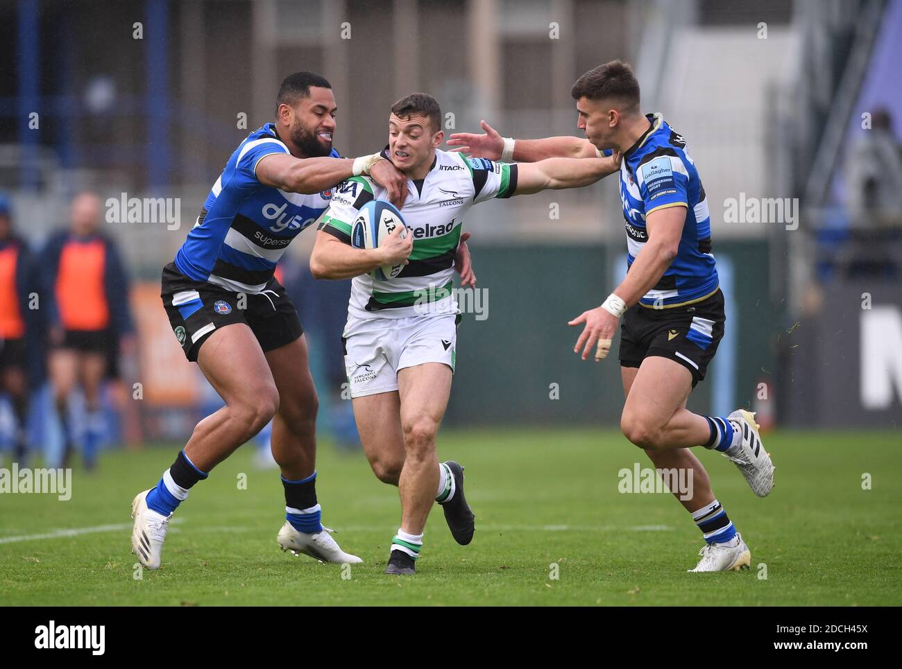 Recreation Ground, Bath, Somerset, UK. 21st Nov, 2020. English Premiership Rugby, Bath versus Newcastle Falcons; Adam Radwan of Newcastle Falcons is tackled by Joe Cokanasiga and Cameron Redpath of Bath Credit: Action Plus Sports/Alamy Live News Stock Photo