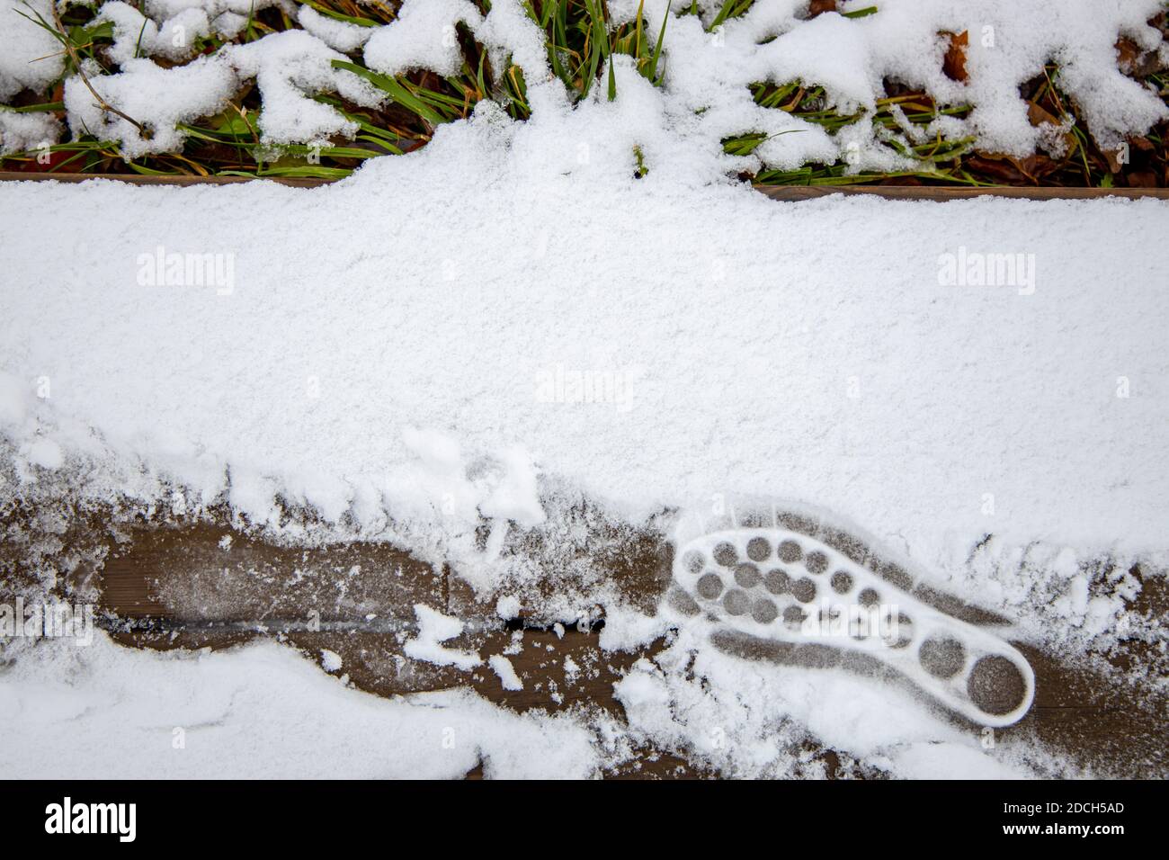 Footprint of shoes on the loose snow Stock Photo