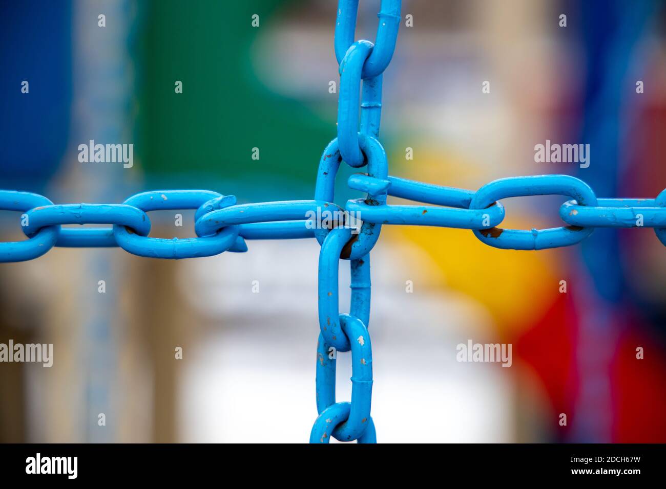 Crossed blue metal chain on blurred background Stock Photo