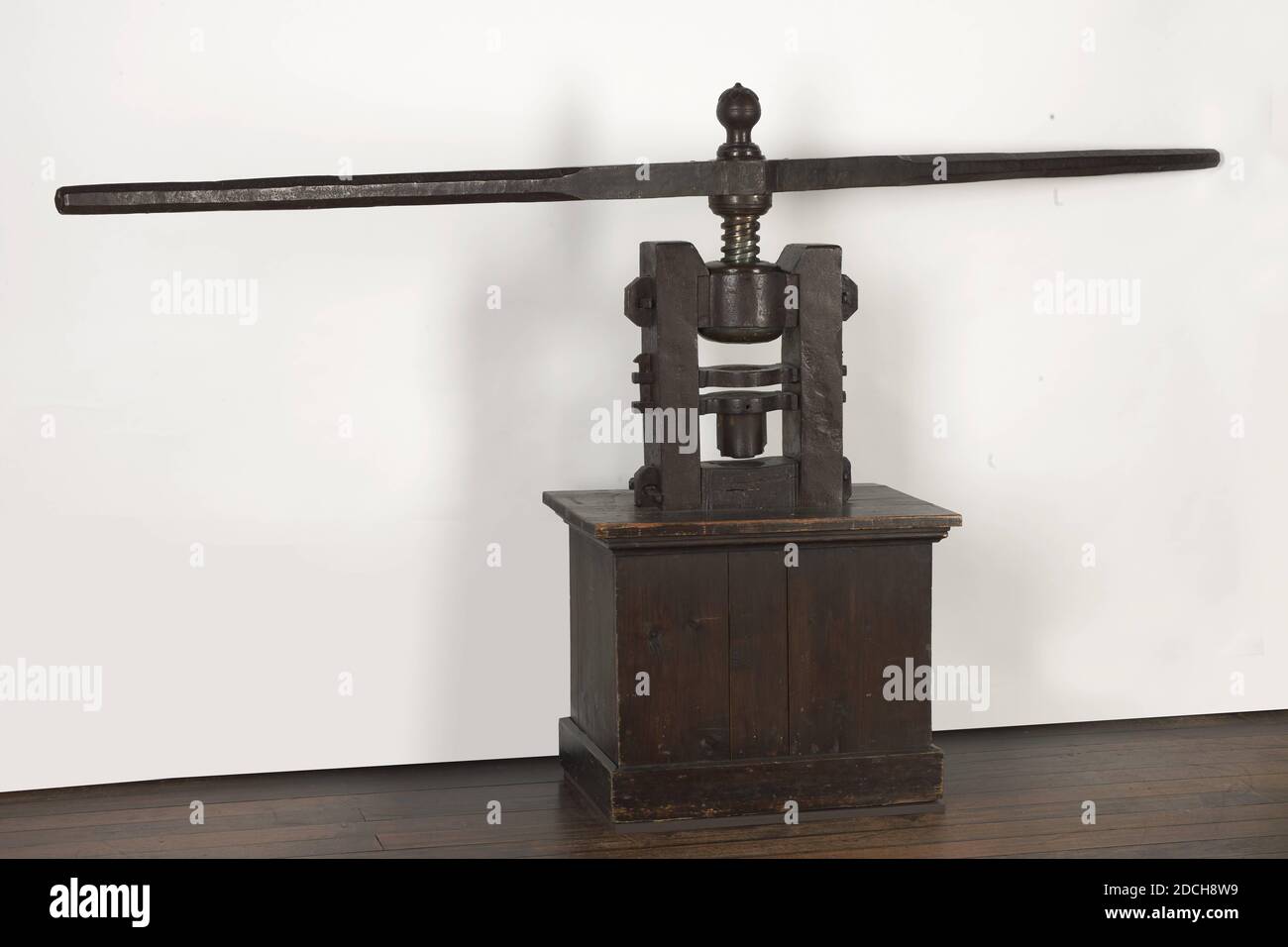 screw press, Anonymous, 18th century, wood, iron, brass, painted, Iron screw press with a brass bush and turning rod, used to stamp or print the sheet. The press stands on a brown-painted wooden base. The bud on top is decorated with leaves, General: 130 × 250 × 43.5cm, 1300 × 2500 × 435mm Stock Photo