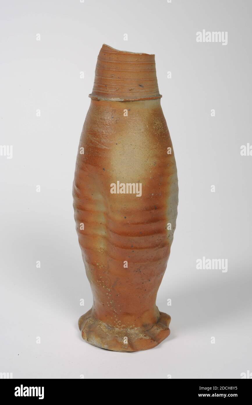 jug, Anonymous, 1425 - 1475, clay glaze, stoneware, General: 26.2 x 9cm 262 x 90mm, Elongated Jacoba can of glazed stoneware, largely covered with salmon-red clay glaze. The jug has a baluster shape with a dent on either side of the widest part. The foot is kneaded. Below the neck a label with 2953. A piece of the neck is missing, 1888 Stock Photo