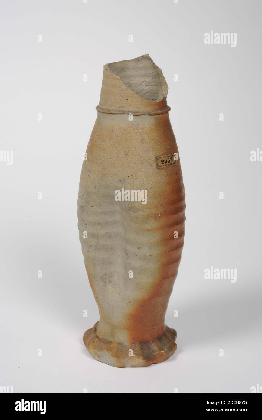 jug, Anonymous, 1425 - 1475, clay glaze, stoneware, General: 26.2 x 9cm 262 x 90mm, Elongated Jacoba can of glazed stoneware, largely covered with salmon-red clay glaze. The jug has a baluster shape with a dent on either side of the widest part. The foot is kneaded. Below the neck a label with 2953. A piece of the neck is missing, 1888 Stock Photo