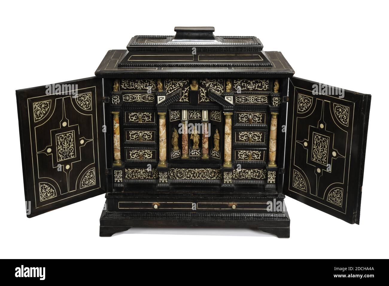 cabinet cupboard furniture, Anonymous, late 17th century, ebony, ivory, iron, spruce, General: 68.5 x 66.4 x 31.6cm 685 x 664 x 316mm, mythology, Germany, Art cabinet of spruce veneer with ebony and inlaid with ivory . The cabinet consists of a cabinet on a plinth with ball feet and a pillow-shaped lid on top. The cabinet is inlaid on the outside with a geometric pattern of ivory. The doors are inlaid both inside and out with a fine arcuate symmetrical Baroque decor filled with arabesques, birds, dolphins, fruit, mythological creatures and gods and goddesses. Black in white on the inside and Stock Photo