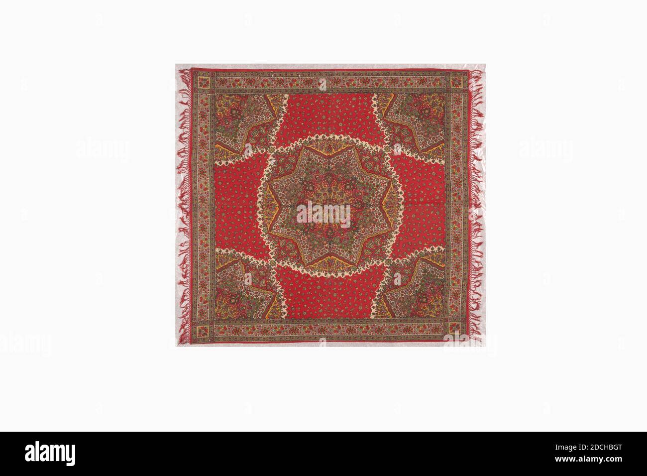 shawl, Anonymous, first quarter of the 19th century, General: 126 × 130cm (measured without fringe), General: 126 × 140cm (measured with fringe), star, flower, Shawl made of fine fabric, printed in the colors Turkish-red, white, black, yellow, green and lilac. In the center a large eight-pointed star filled with flower and leaf motifs. A quarter of the star (two points) is repeated in the four corners of the shawl. Between the star motifs small flowers on a Turkish-red background. The shawl is completely framed by a narrow red border followed by a wide flower border. Two sides finished with Stock Photo