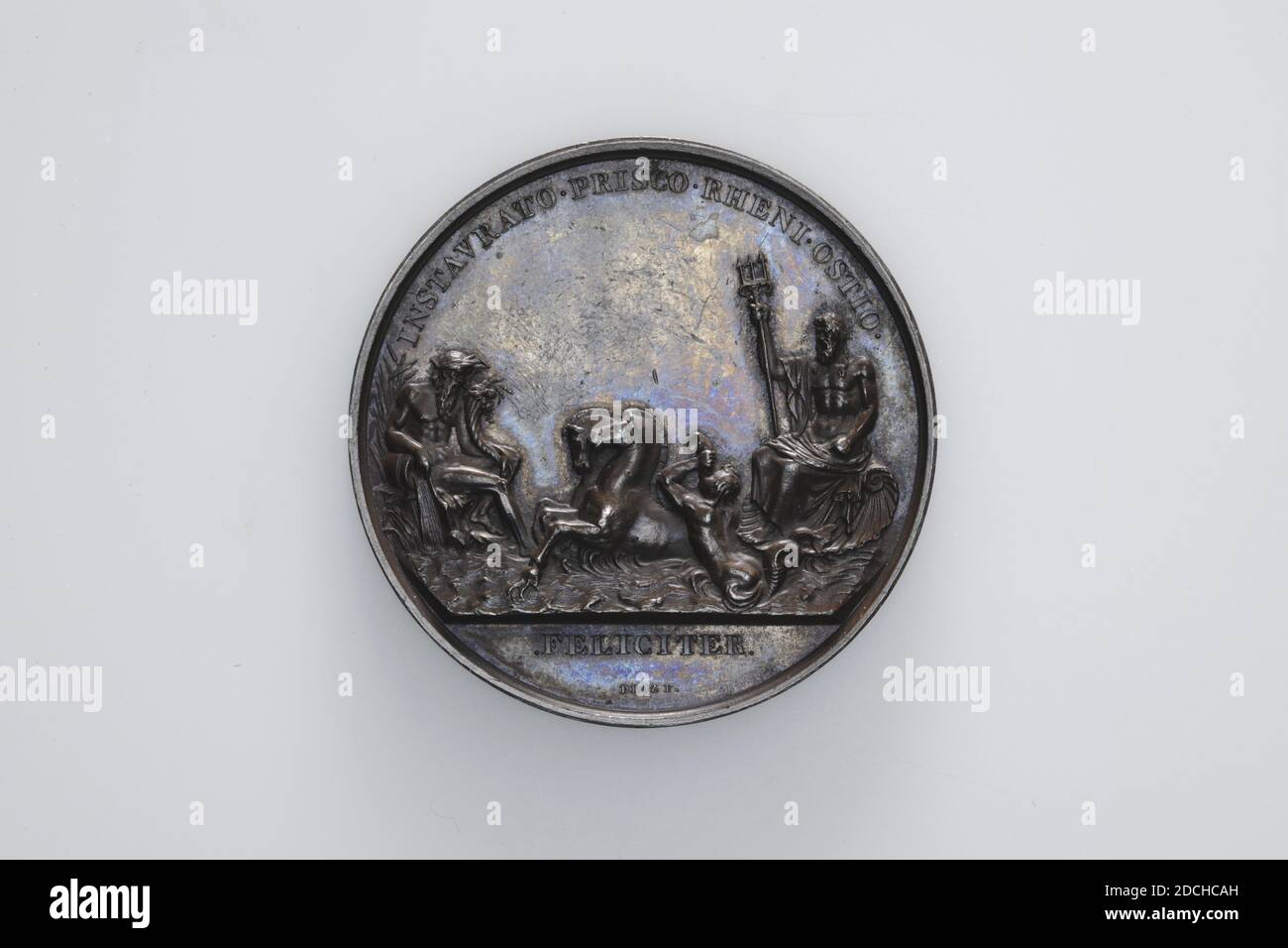 medal, Jean Pierre Droz, 1807, minted, General: 4.6 x 0.4cm (46 x 4mm), Weight: 59.3g, horse, weapon (sign), Silver medal on the opening of the locks at Katwijk in 1807 The obverse depicts Neptune on the right, seated on a conch-shaped victory cart drawn by two seahorses. For this, the horn-blowing Triton. On the left a seated river god (the Rhine), used to the right, with a horn of plenty in his left arm. His right arm rests on a jug from which water flows. Below the performance the inscription: FELICITER, and above it the inscription: INSTAVRATO.PRISCO.RHENI.OSTIO. Marked on the cut. On the Stock Photo