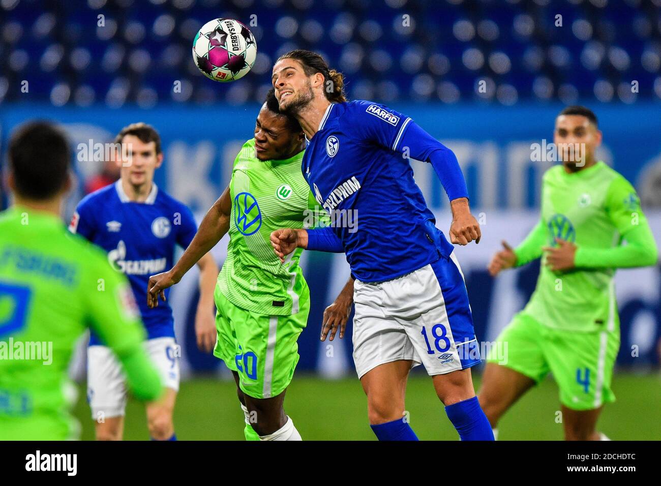 21 November 2020, North Rhine-Westphalia, Gelsenkirchen: Football: Bundesliga, 8th matchday, FC Schalke 04 - VfL Wolfsburg, Veltins Arena. Goncalo Paciencia (2nd from right) from Schalke in action against Ridle Baku (3rd from left) from Wolfsburg. Photo: Martin Meissner/Pool AP/dpa - IMPORTANT NOTE: In accordance with the regulations of the DFL Deutsche Fußball Liga and the DFB Deutscher Fußball-Bund, it is prohibited to exploit or have exploited in the stadium and/or from the game taken photographs in the form of sequence images and/or video-like photo series. Stock Photo
