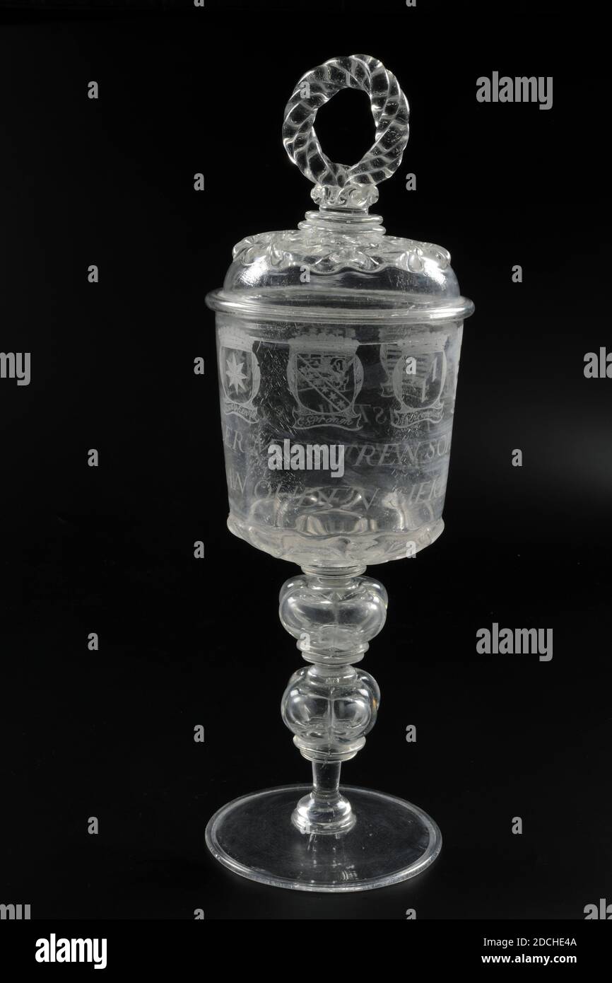 glass jar, between 1686-1687, total: 39.4 x 12.8cm 394 x 128mm, jar: 27.2 x 12.3cm 272 x 123mm, lid: 13 x 12.8cm 130 x 128mm, coat of arms, family crest, Jar of colorless glass with lid. The jar has an almost flat base with folded edge. Shank with foot ring and two hollow four-lobed buttons with a collar under two and above and two collars under the chalice bottom. Cup-shaped chalice, the bottom of which is decorated with crosswise projecting ribs. The decoration is repeated on the lid which has an open circle of three twisted strands as a button. The lid has a crown in the form of a twisted Stock Photo