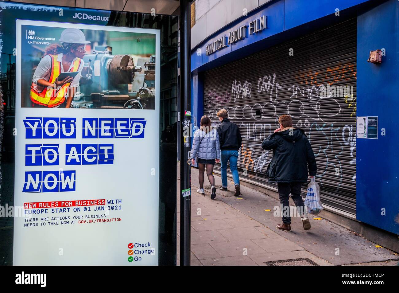 London, UK. 21st Nov, 2020. Advertising with warnings and advice (Time is running out) about Brexit - outside a closed Odeon Cinema - People are still out in Camden Town, despite the new lockdown which is now in force. However there is little to do as the shops, leasure and hospitality businesses are shut. Many people wear masks, even outside. Credit: Guy Bell/Alamy Live News Stock Photo