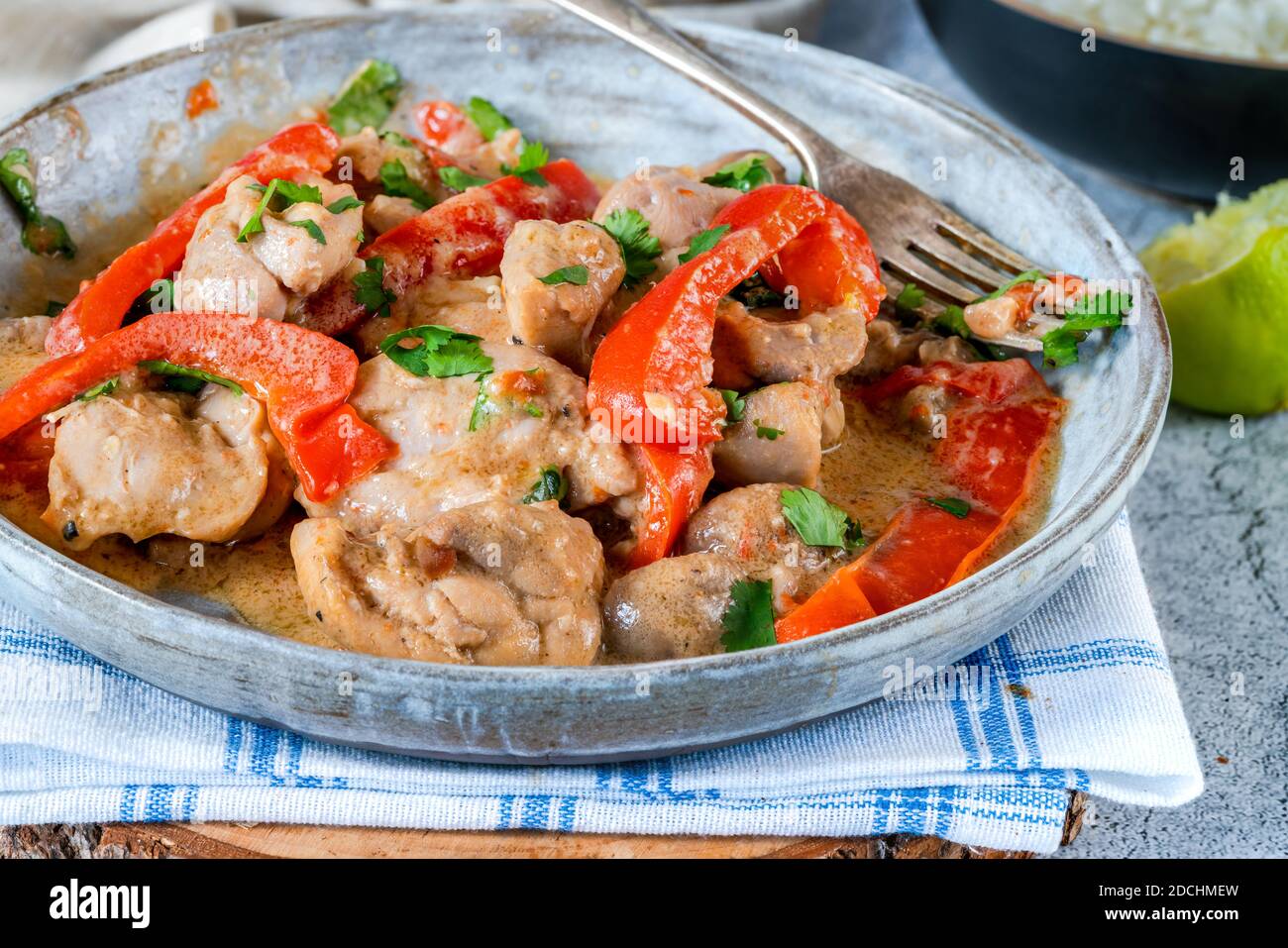 Indonesianstyle chicken in peanut butter sauce with red peppers and