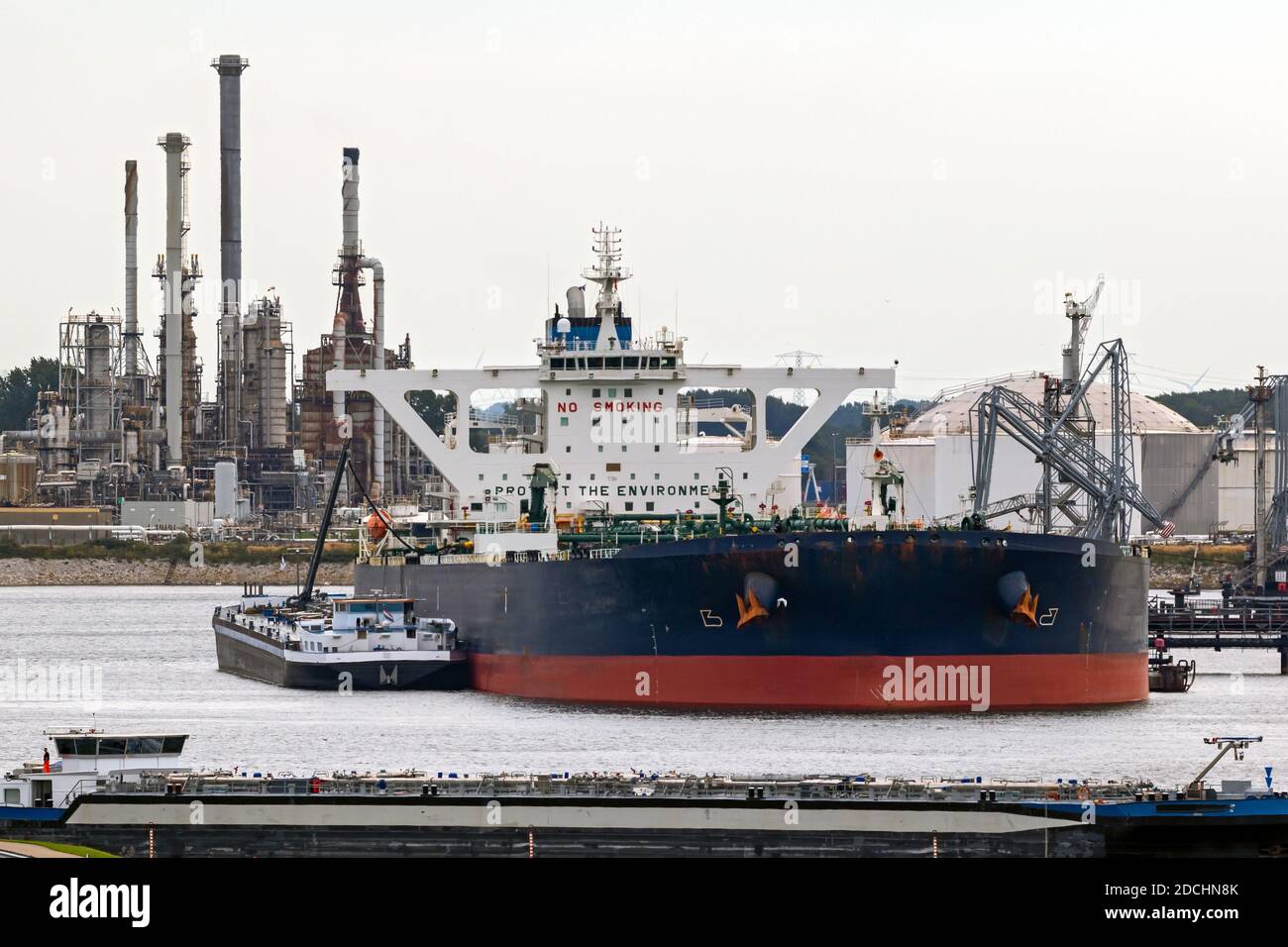 Oil tankers moored near a petrochemical plant in the Port of Rotterdam. Rotterdam. Stock Photo