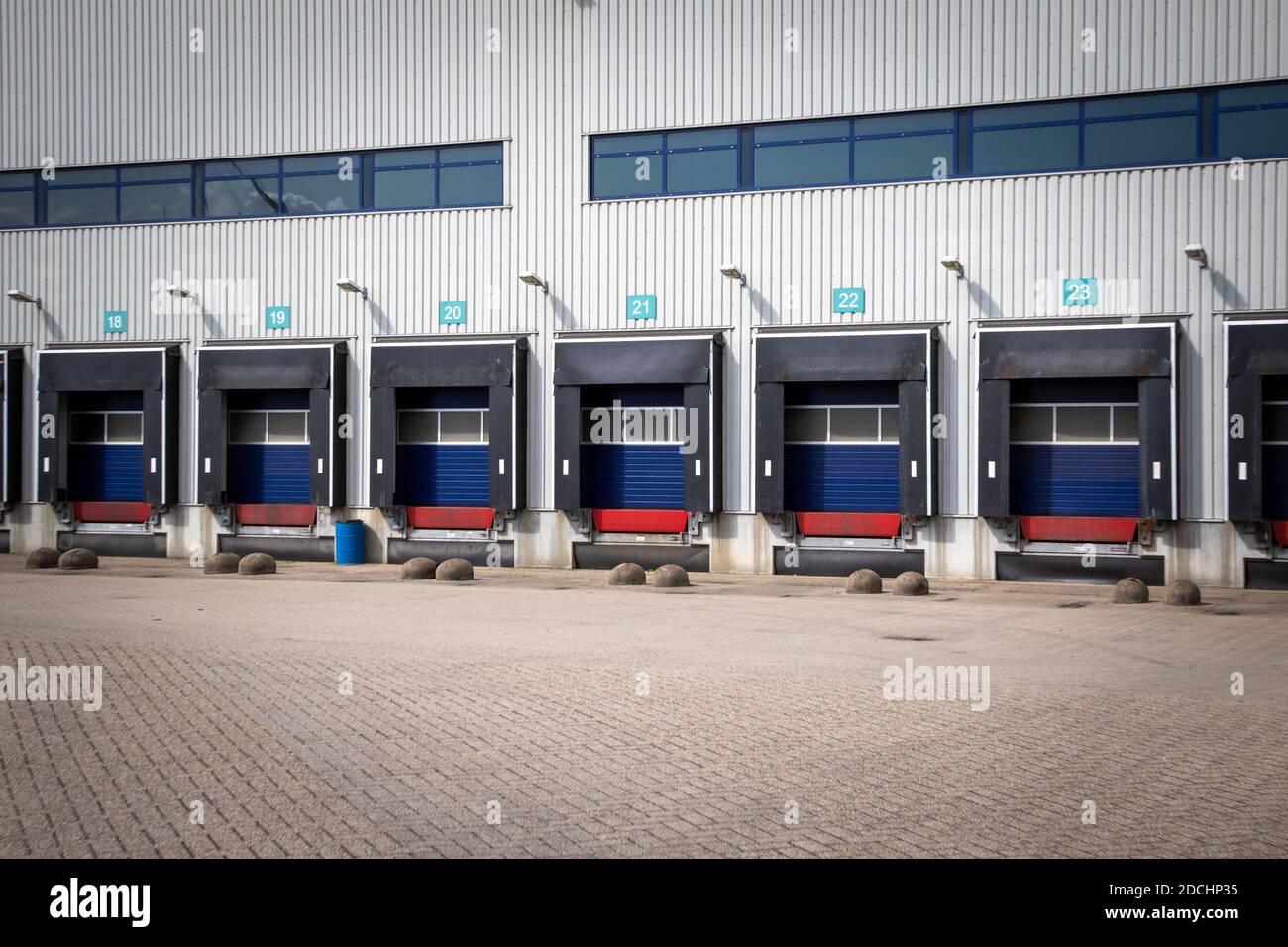 Row of loading docks with shutter doors at an industrial warehouse