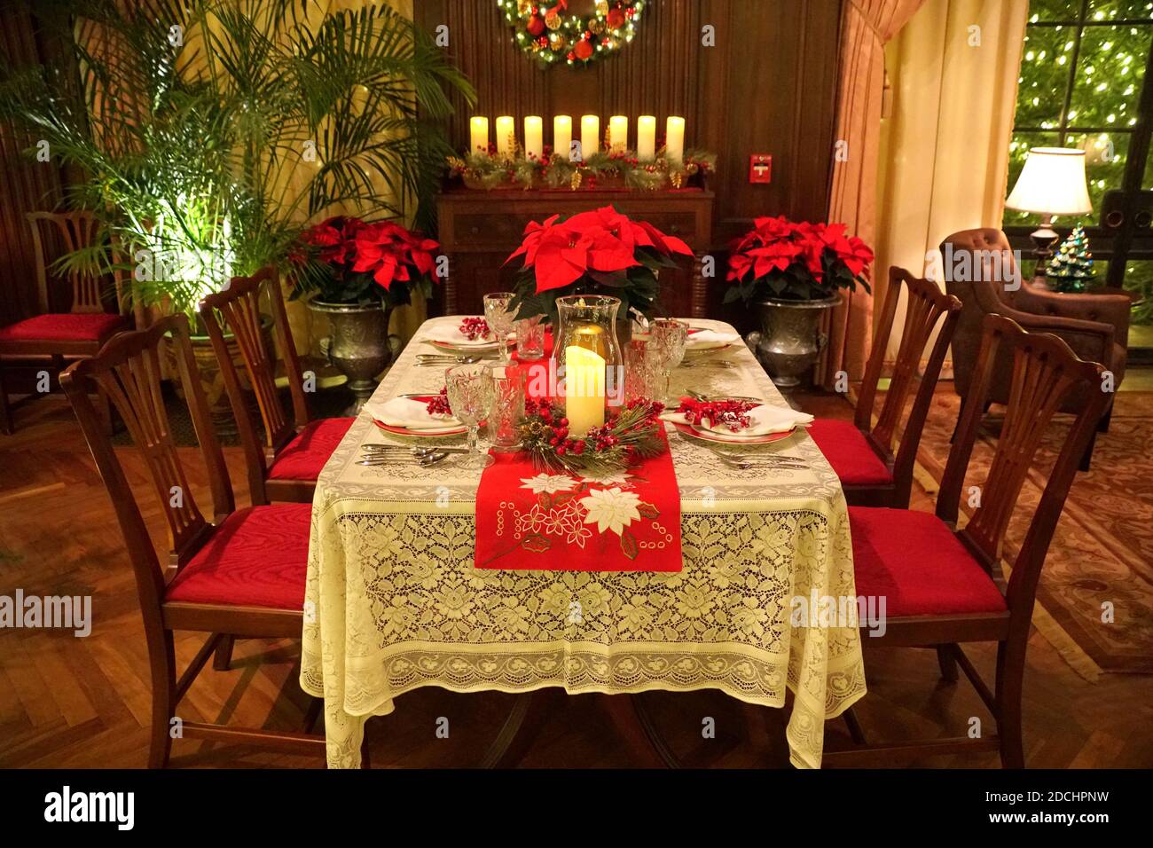 A dinner room and table decorated for Christmas Stock Photo
