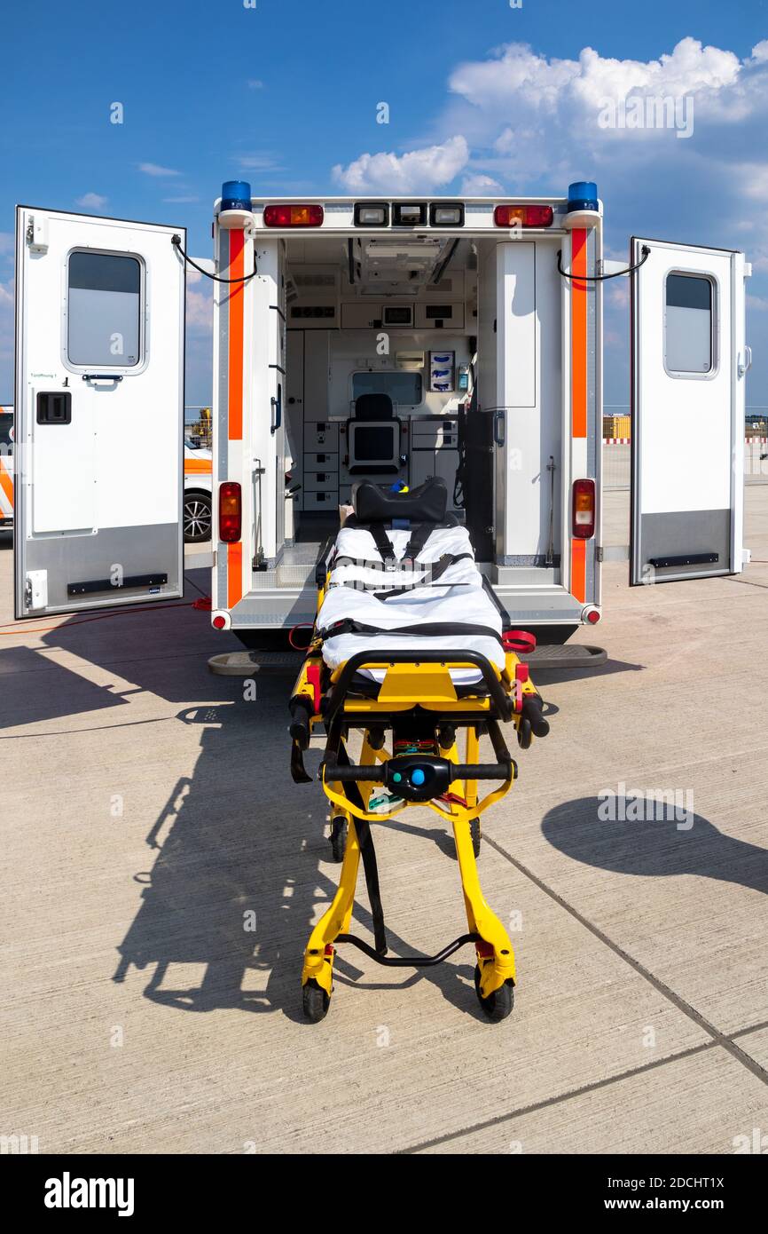 Emergency stretcher and EMS ambulance with open door Stock Photo