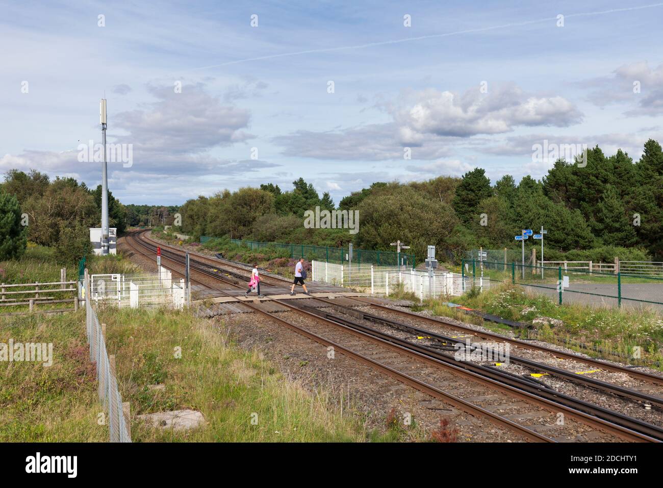 Freshfield railway level crossing with pedestrians using the level crossing Stock Photo