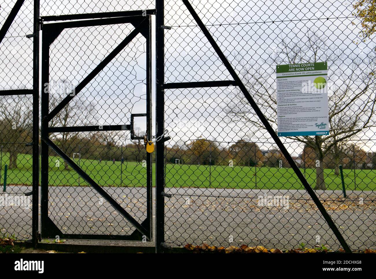 Tennis court closed with padlock due to covid19 regulations during England's second national coronavirus lockdown. Sunny Hill Park, Hendon, London. Stock Photo