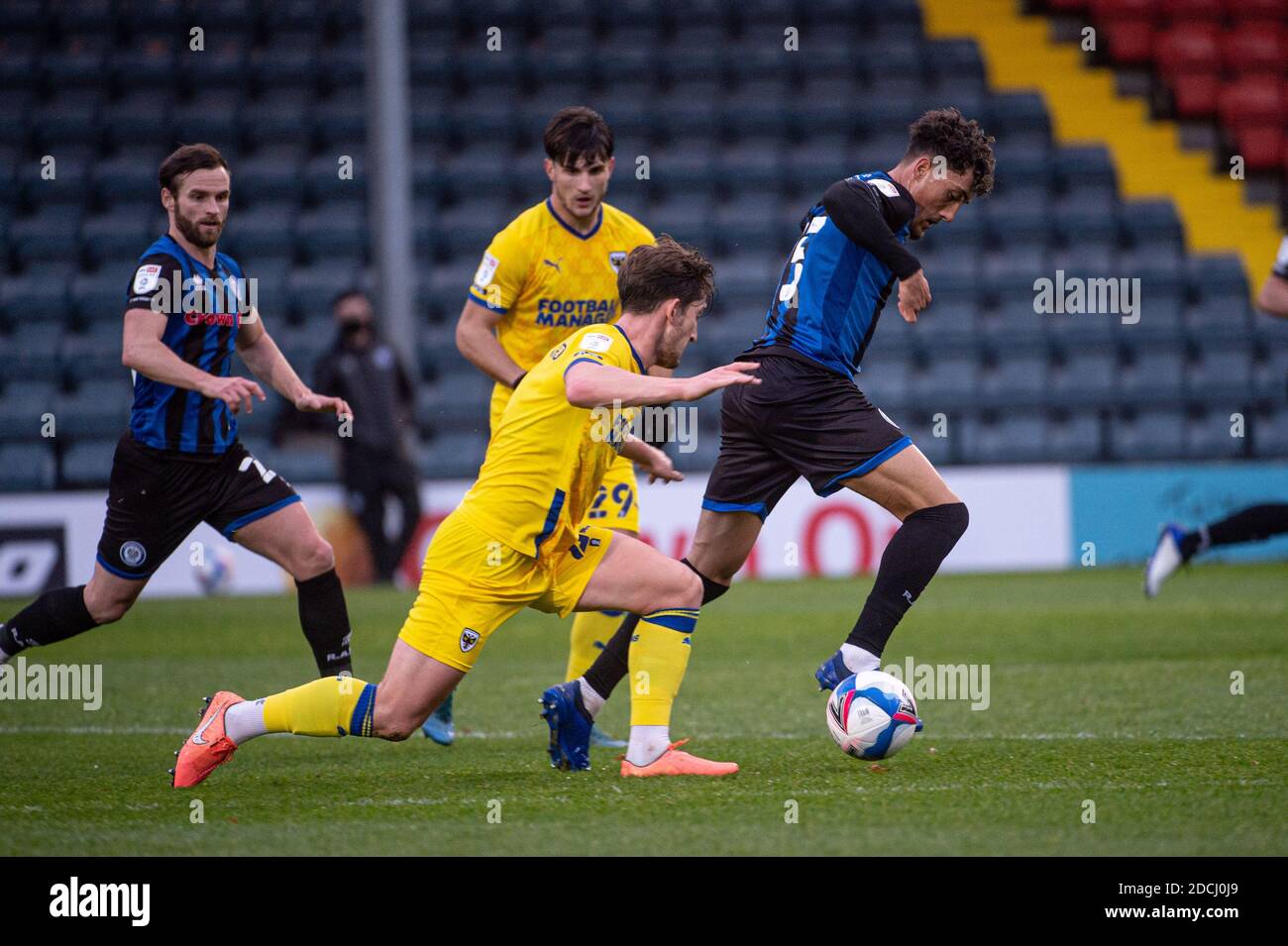 ROCHDALE, ENGLAND. NOVEMBER 21ST Haydon Roberts of Rochdale AFC is tackled by Alex Woodyard of AFC Wimbledon during the Sky Bet League 1 match between Rochdale and AFC Wimbledon at Spotland Stadium, Rochdale on Saturday 21st November 2020. (Credit: Ian Charles | MI News) Credit: MI News & Sport /Alamy Live News Stock Photo