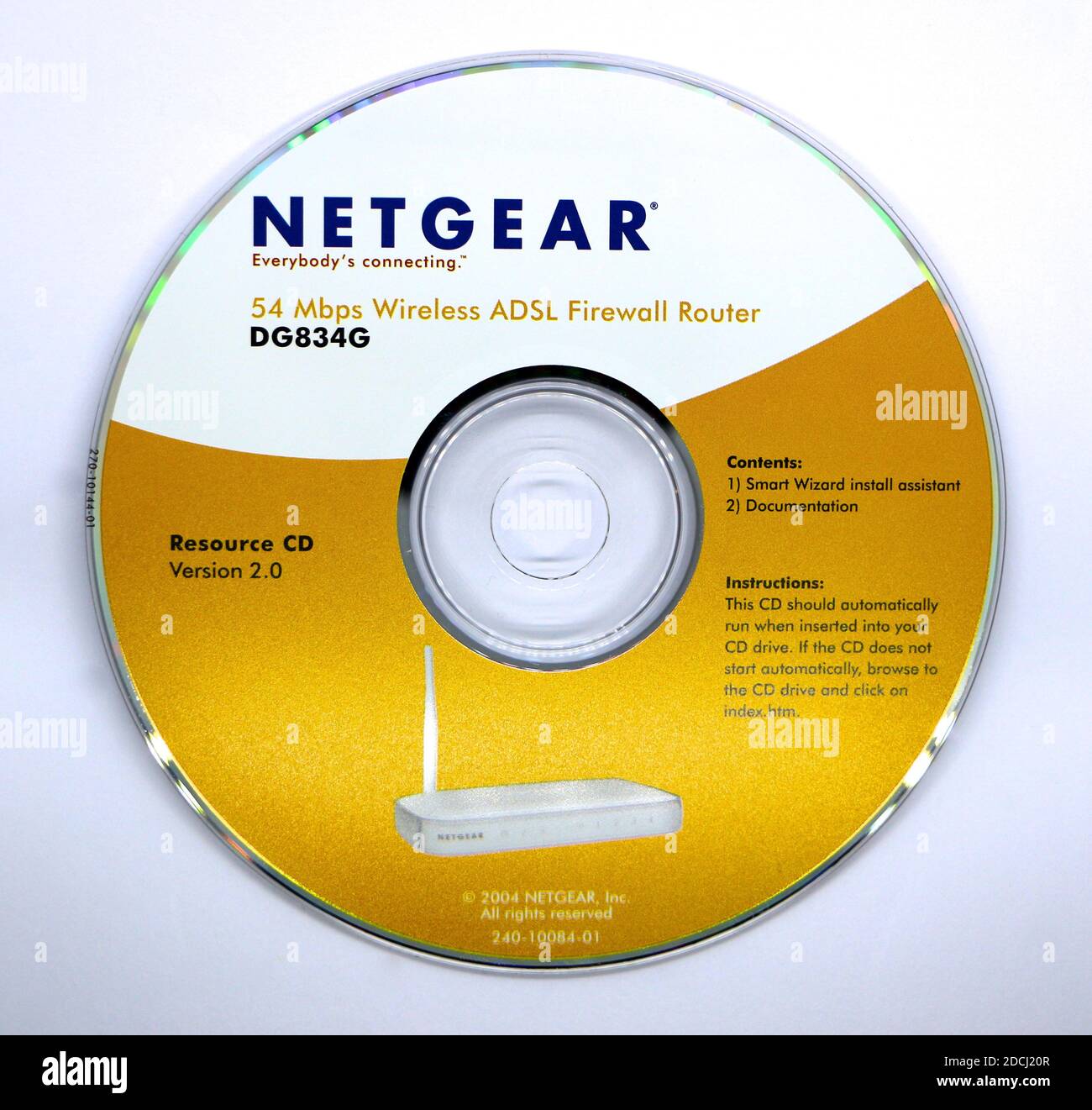 Photo of a Netgear 5.4 mbps wireless adsl firewall router resource CD from  2004 on a white background Stock Photo - Alamy