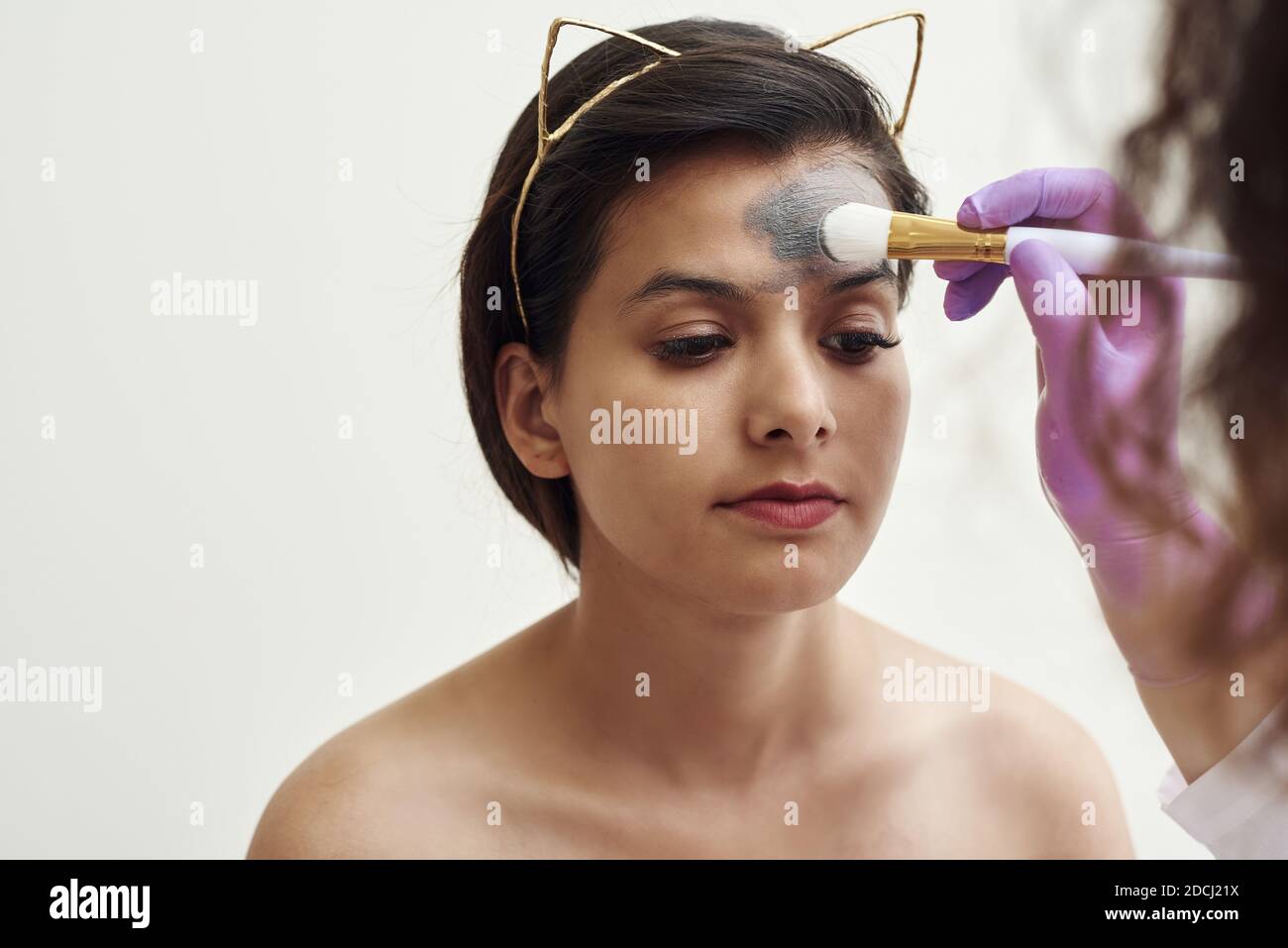 Spa beauty treatment, skincare. Woman getting facial care by beautician