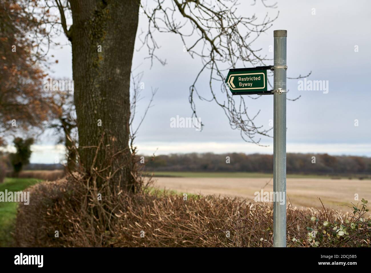 Restricted byway sign indicating a track without motor vehicle access through Lincolnshire farmland public right of way Stock Photo