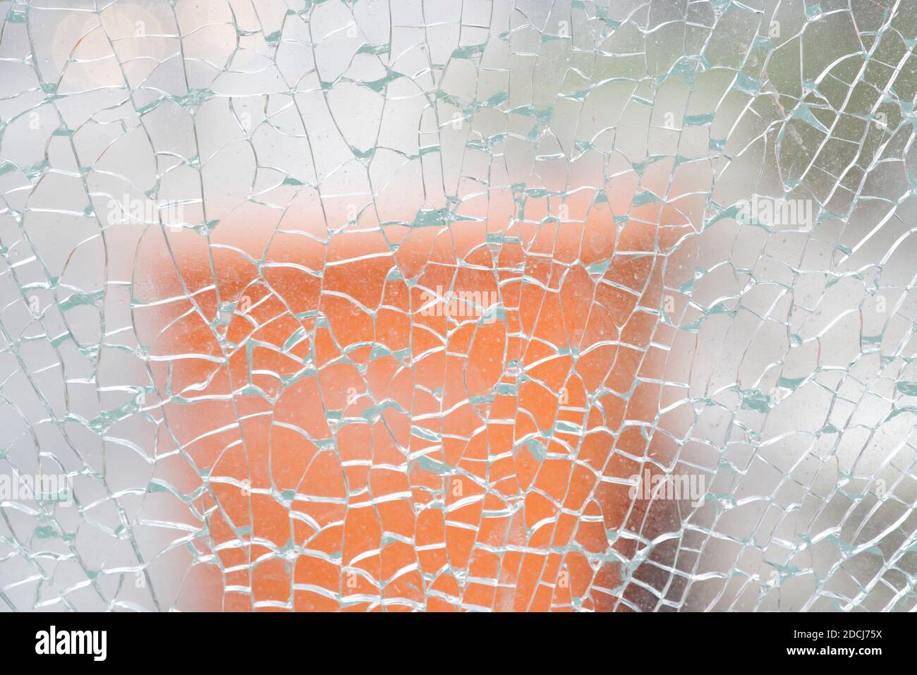 broken glass with cracks net, heavy defocused background Stock Photo