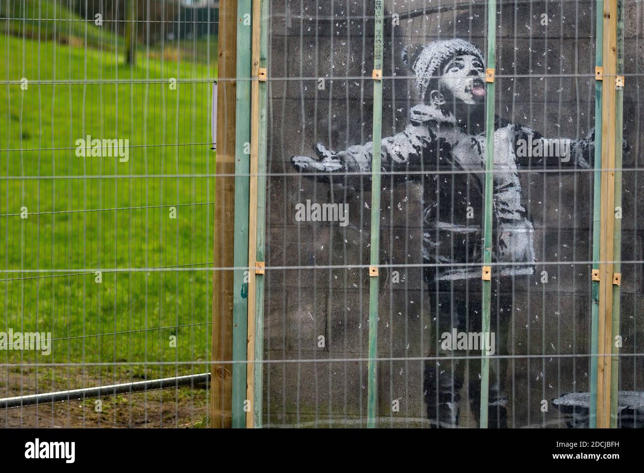 Artwork by Banksy on the wall of a garage in Port Talbot, Wales, UK