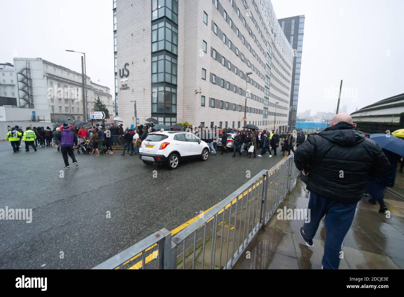 Skelhorne St, Liverpool, 21st Nov 2020: Anti lockdown protesters march across the road to Copperas Hill blocking traffic at Unite Students residences Stock Photo