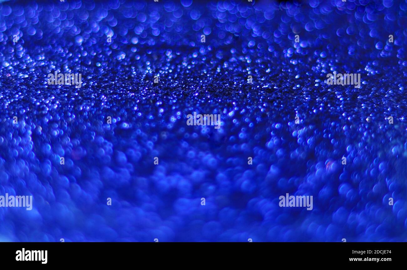 A closeup shot of beautiful blue sprinkles for wallpaper or background Stock Photo