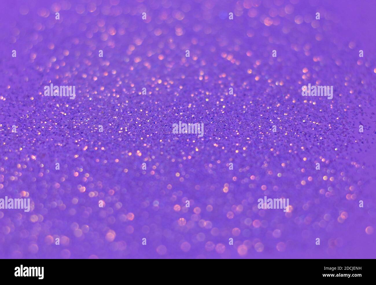 A closeup shot of beautiful purple sprinkles for bwallpaper or background Stock Photo