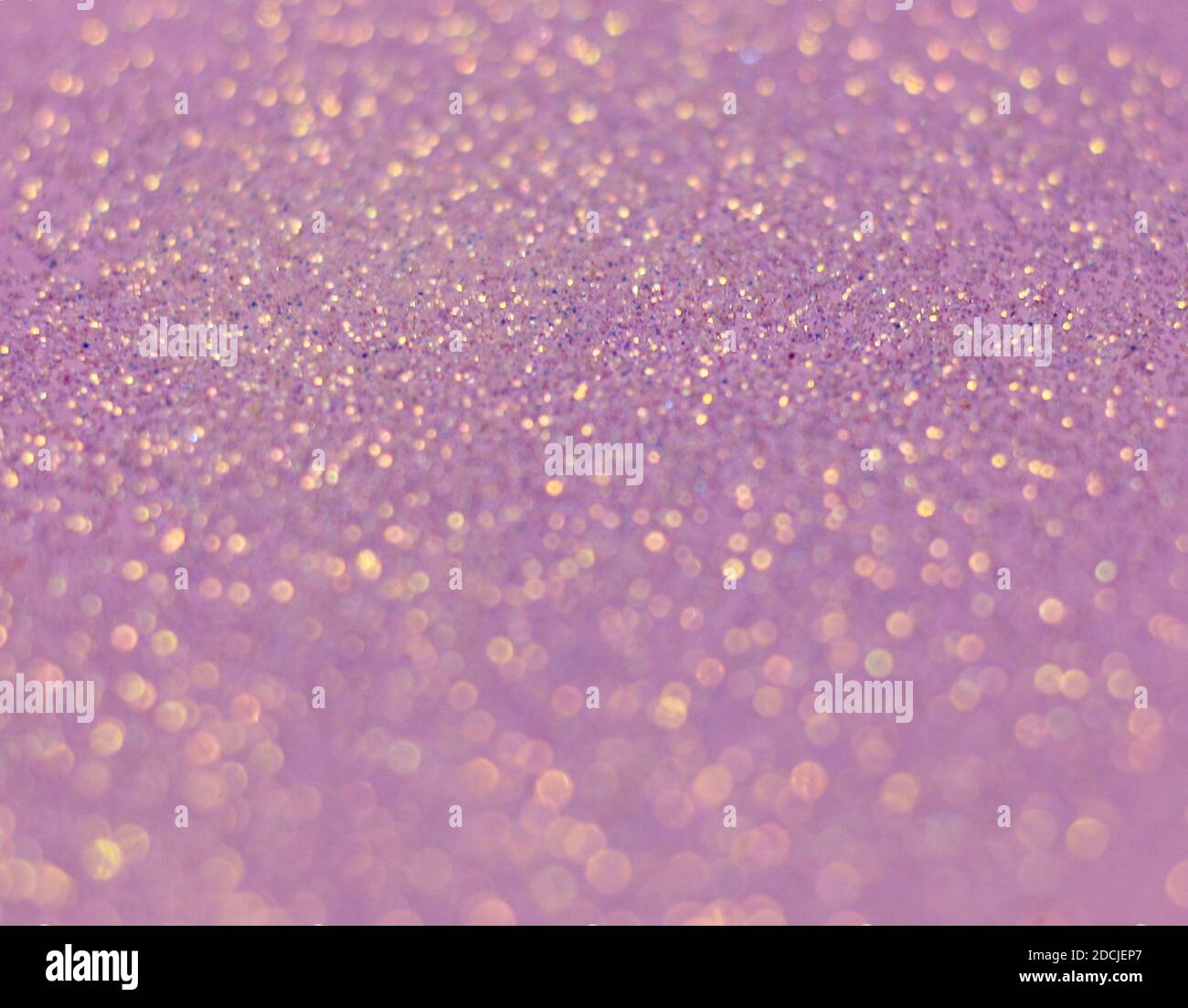A closeup shot of beautiful purple sprinkles for wallpaper or background Stock Photo