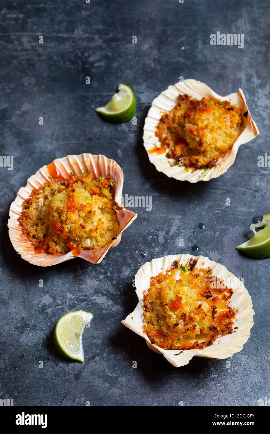 Baked scallops with spicy breadcrumbs Stock Photo