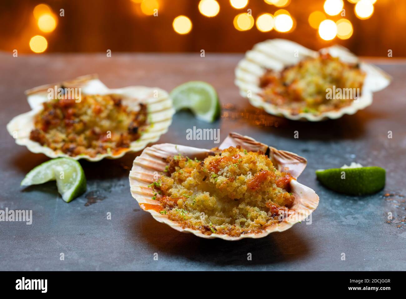 Baked scallops with spicy breadcrumbs Stock Photo Alamy
