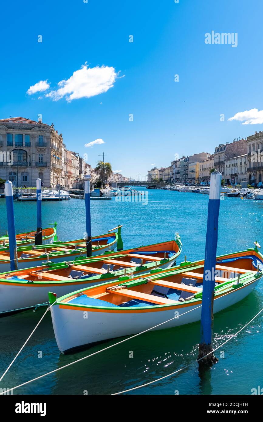 Sète in France, traditional boats moored at the quay in the city centre Stock Photo