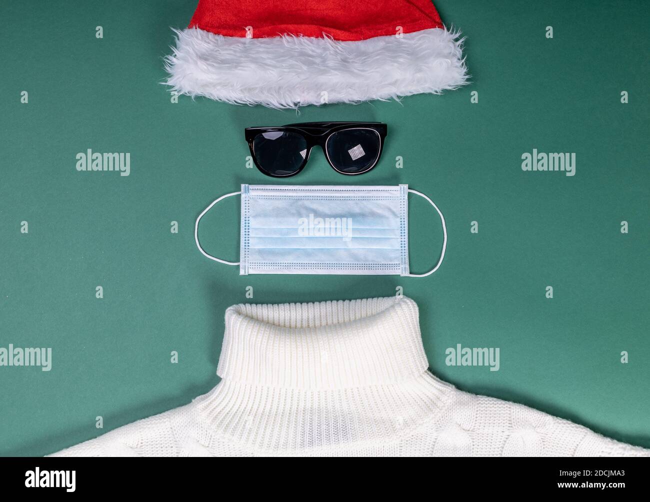 red hat mask and white sweater flat lay shape of Santa Slaus Stock Photo