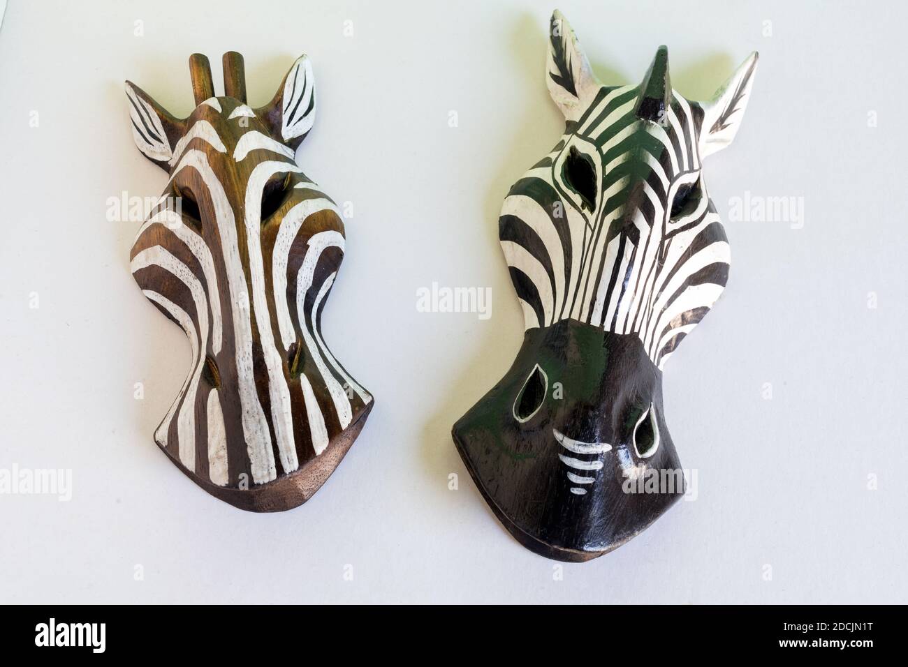 African wooden zebra masks on green background Stock Photo Alamy